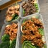 Healthy meal prep with chicken, beef, and vegetable rice bowls for fitness and nutrition.