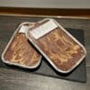 Delicious homemade peanut butter protein flapjack with marbled chocolate topping, perfect for fitness and health enthusiasts.
