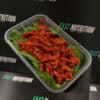Delicious grilled chicken strips on fresh spinach leaves, perfect for healthy nutrition and high-protein meals.