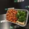 High-protein meal prep with chicken, broccoli, and pasta from Fast Nutrition meal service.