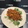 Healthy meal prepped wrap with lean meat, fresh greens, and vegetables. Perfect for nutrition and muscle gain.