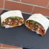 Healthy chicken wrap with fresh vegetables and lean protein, perfect for balanced nutrition.
