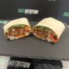 Vibrant wrap filled with chicken, fresh vegetables, and healthy grains. Perfect for a nutritious meal from Fast Nutrition.