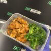 Nutritious chicken and broccoli meal in a meal prep container.