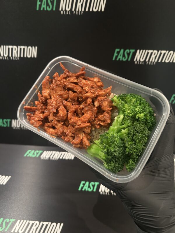 High protein meal prep with lean meat and fresh broccoli for muscle building and healthy eating.