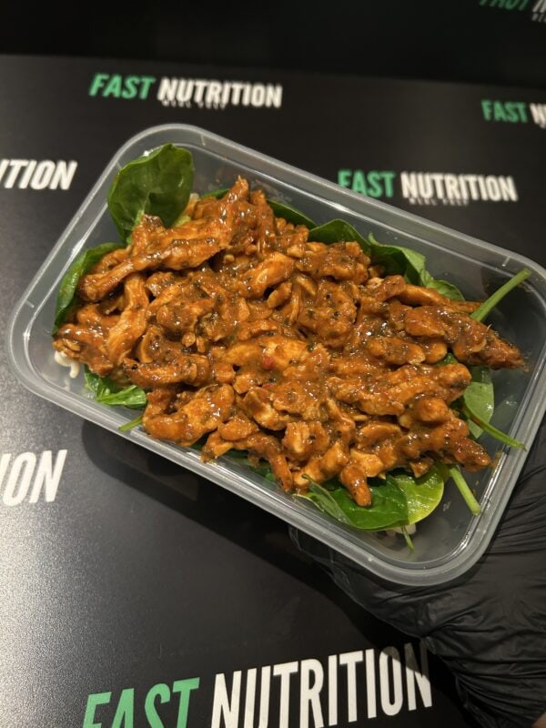 Healthy chicken with greens, perfect for muscle recovery and fitness nutrition.