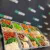 Delicious, nutritious meal prep containers with rice, vegetables, and healthy proteins for fitness.