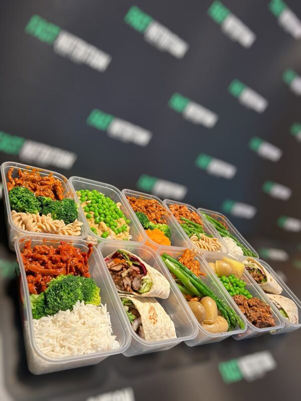 Delicious, nutritious meal prep containers with rice, vegetables, and healthy proteins for fitness.