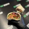 Delicious protein wrap with fresh vegetables, ideal for fitness and healthy eating.