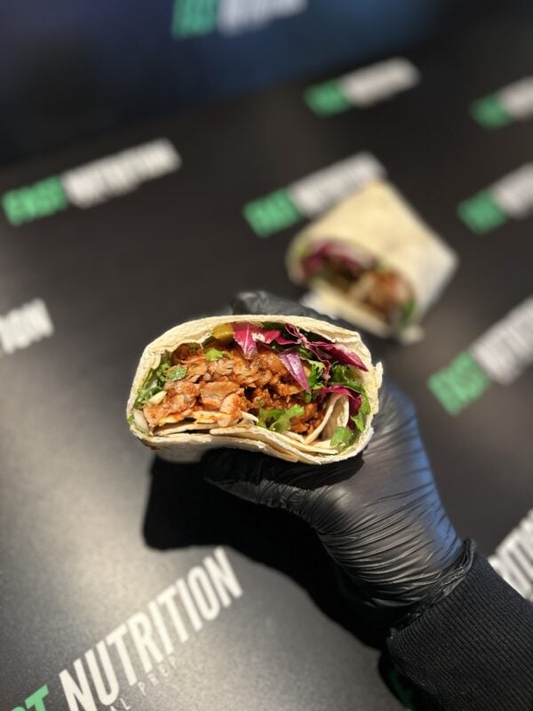 Delicious protein wrap with fresh vegetables, ideal for fitness and healthy eating.